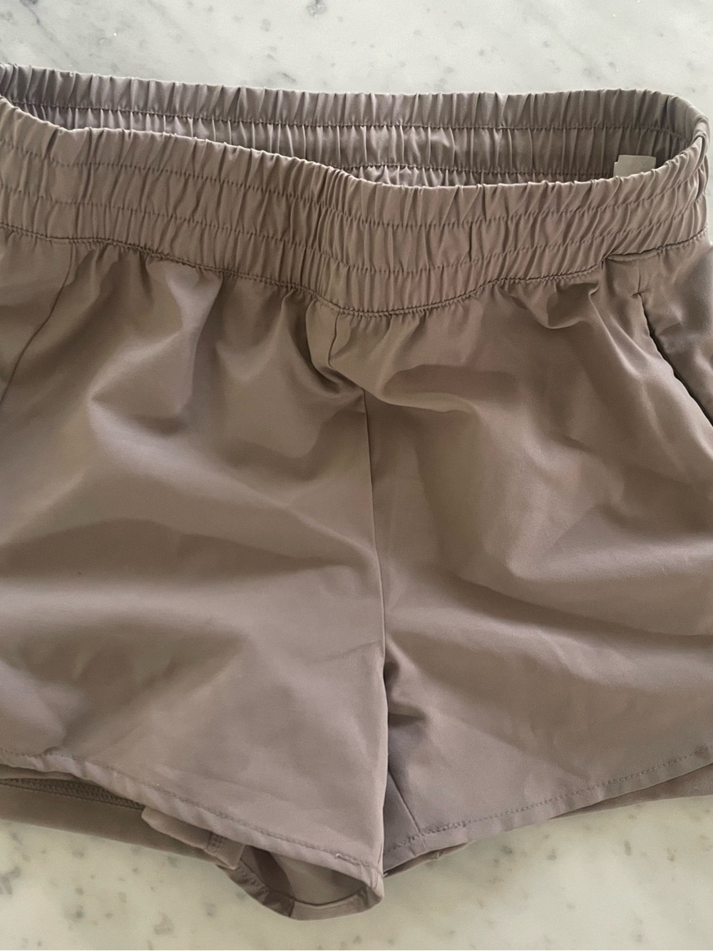 Women’s REEBOK athletic shorts with compression shorts built in.